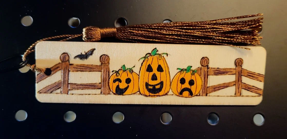 #206 three little pumpkins by fence