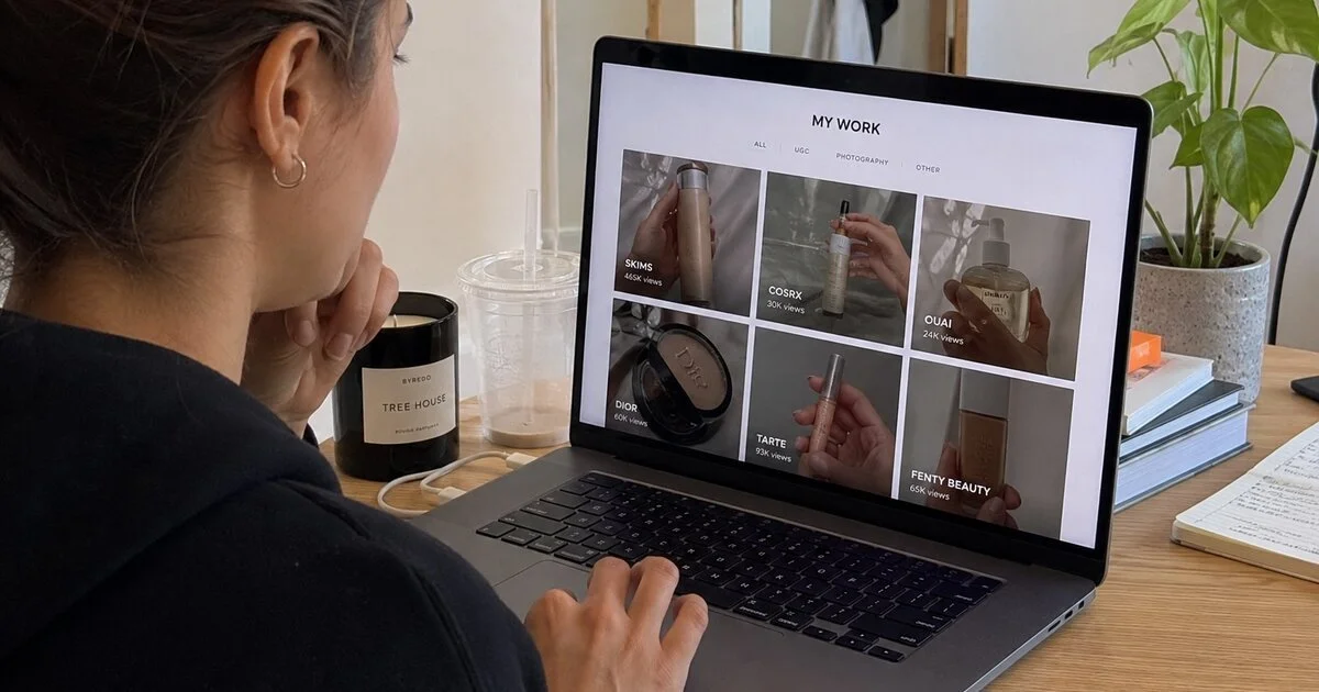 A UGC creator reviewing their portfolio of product videos on a laptop