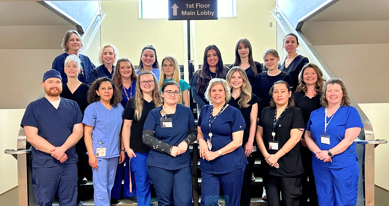 Photo if the WNCCHS Dental Team posing and smiling as a group on stairs.