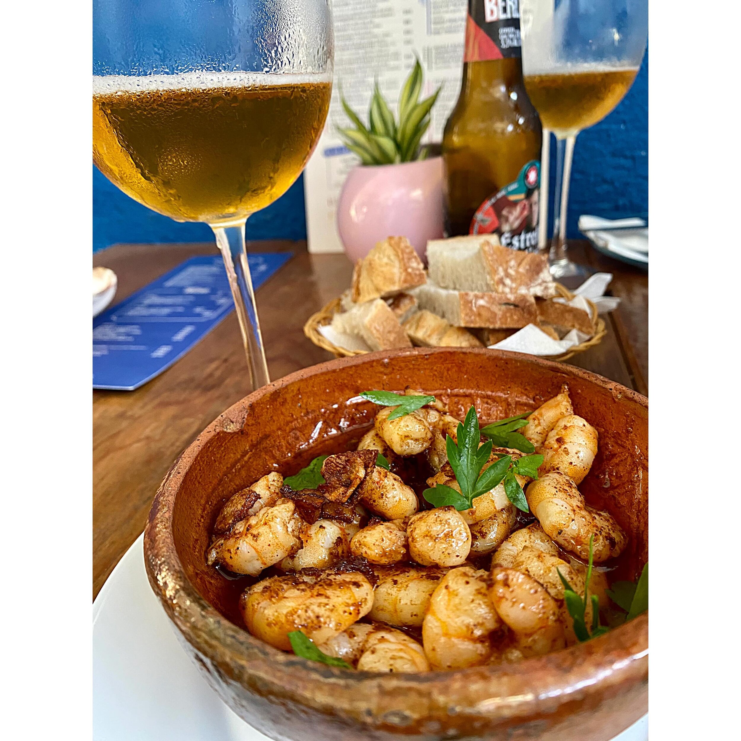 We tucked ourselves under the stairs, in a tiny nook outside. First, they brought ice cold Estrella, then the spicy sizzling gambas with chewy sour bread for soaking up the garlic oil. I could have eaten this for hours.