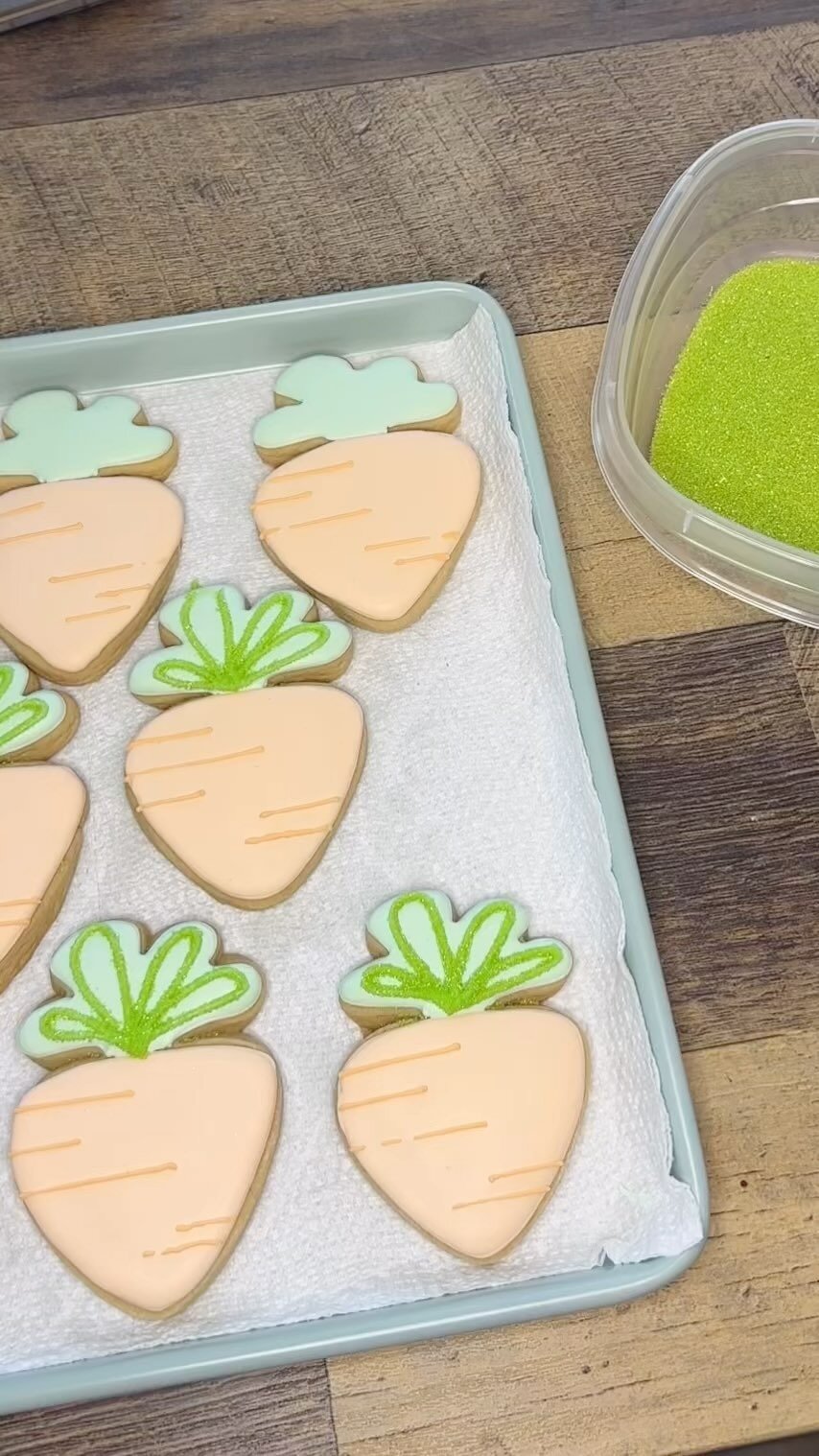 Putting the finishing touches on the carrots. Sprinkles are my favorite! #sprinkles #customcookies #eastertreats