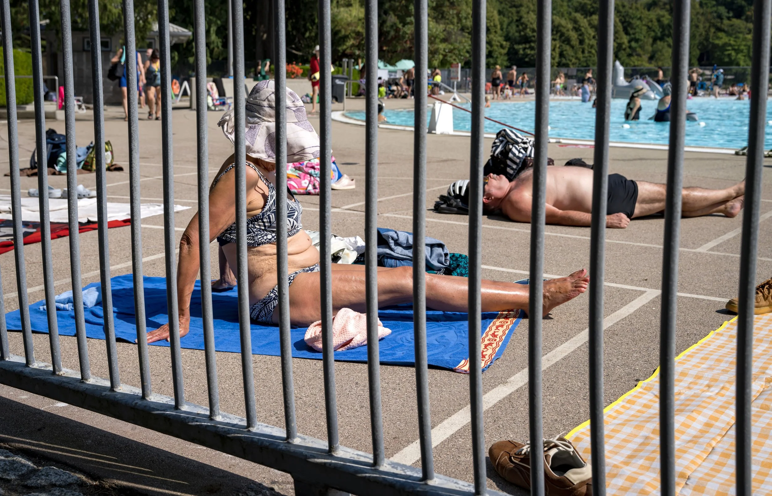 Older woman in bikini behind bars.jpg