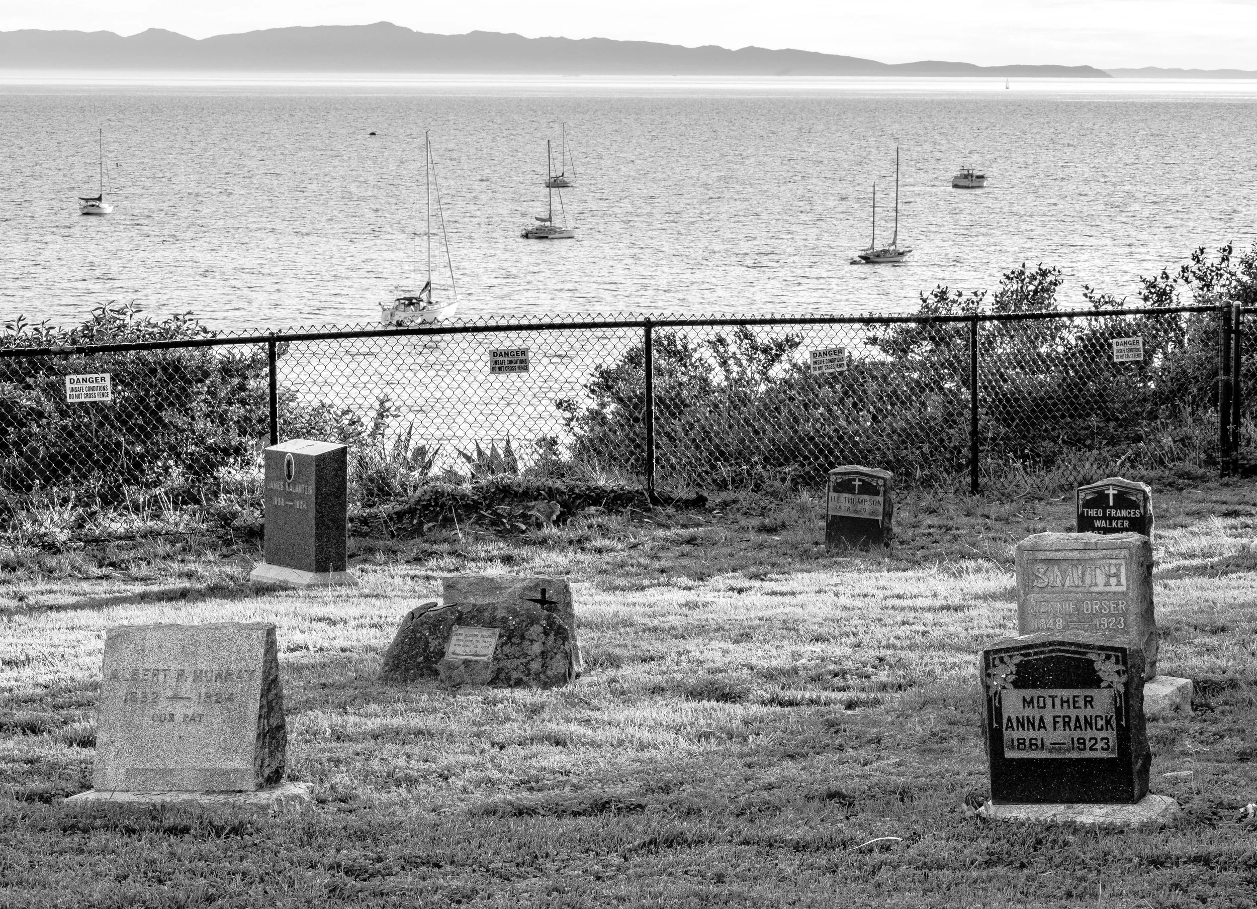 Headstones overlooking yachts bnw.jpg