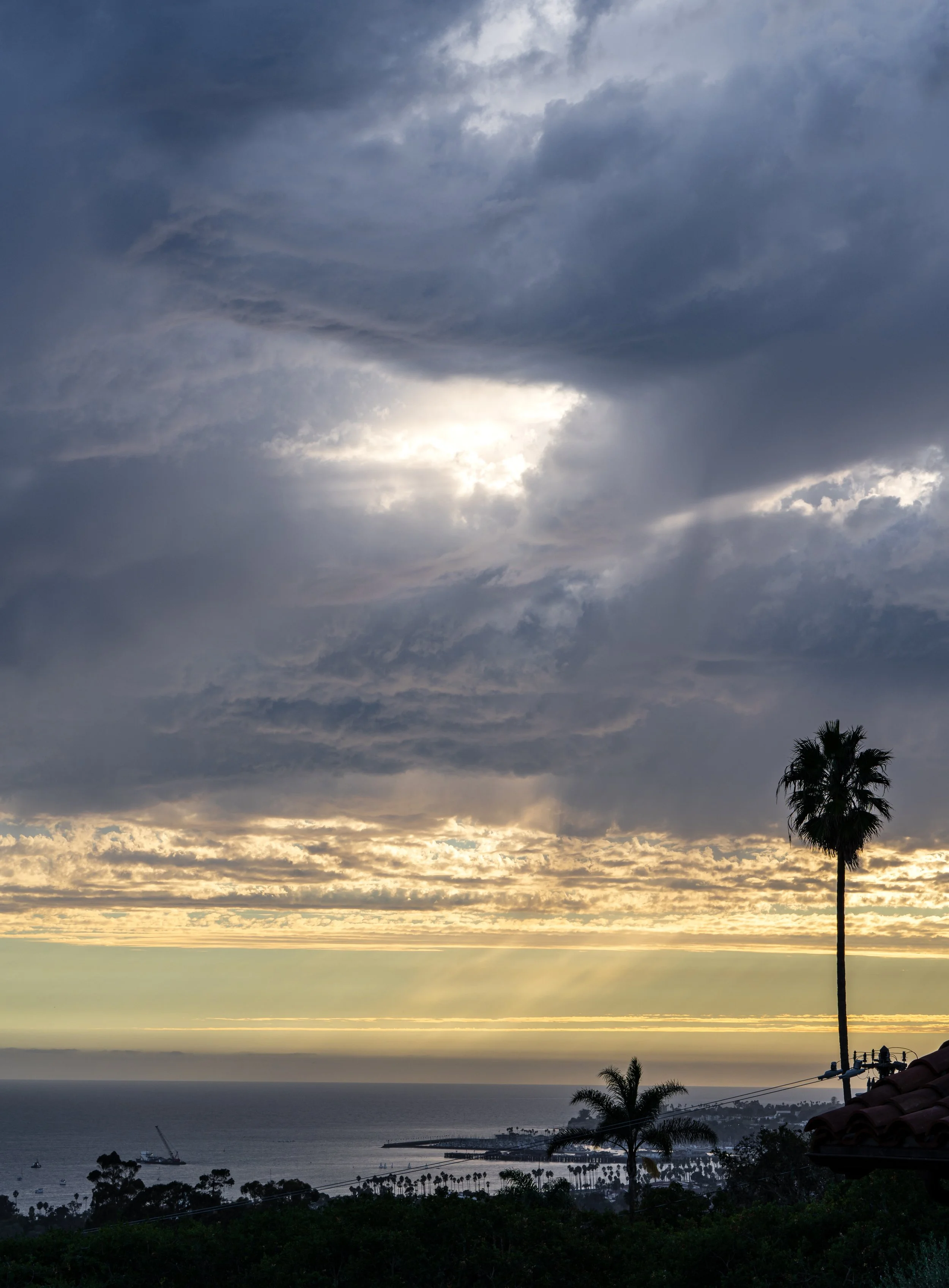 Clouds sunset above harbor vertical.jpg