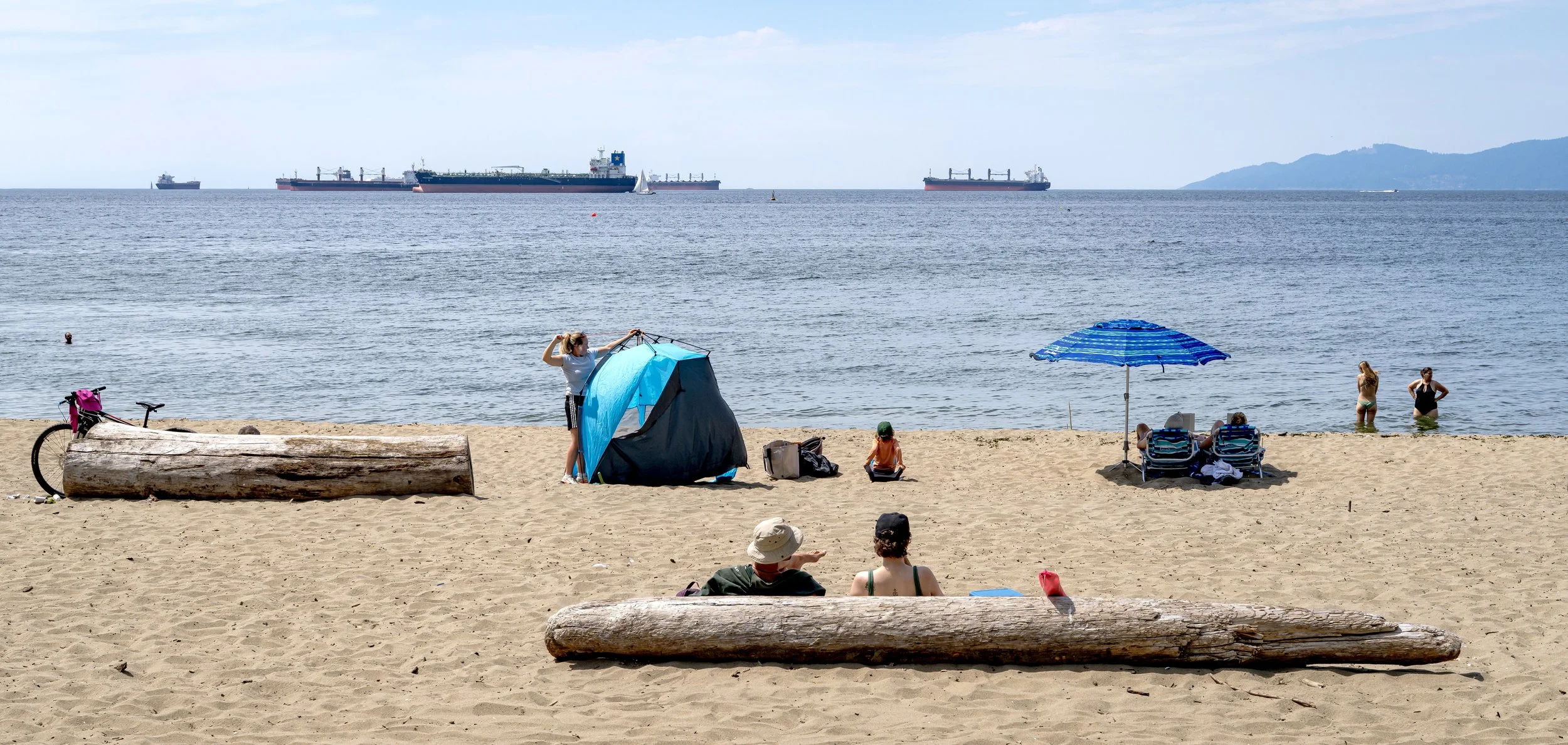Tent raiser and others on beach.jpg