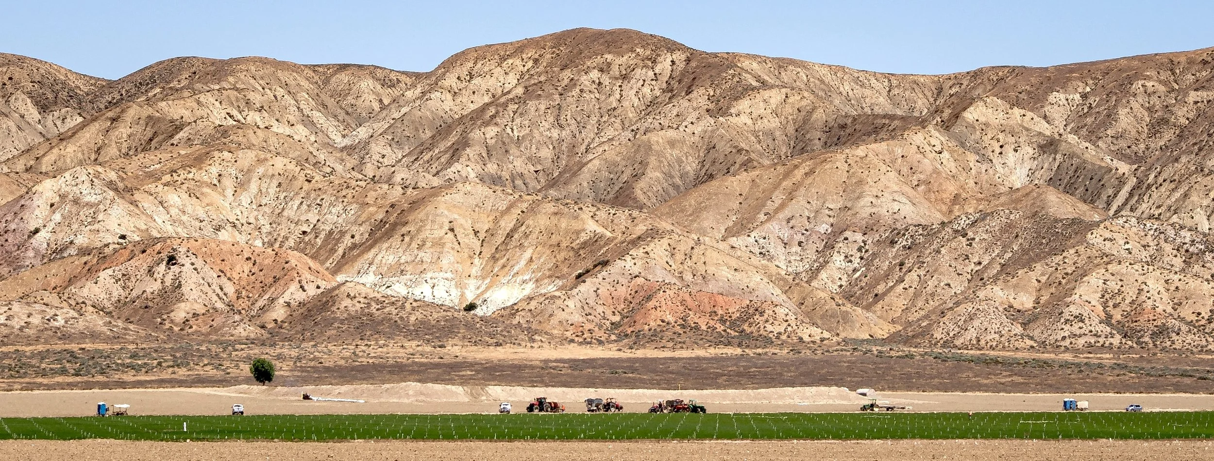 Farm vehicles at base of hillside color.jpg