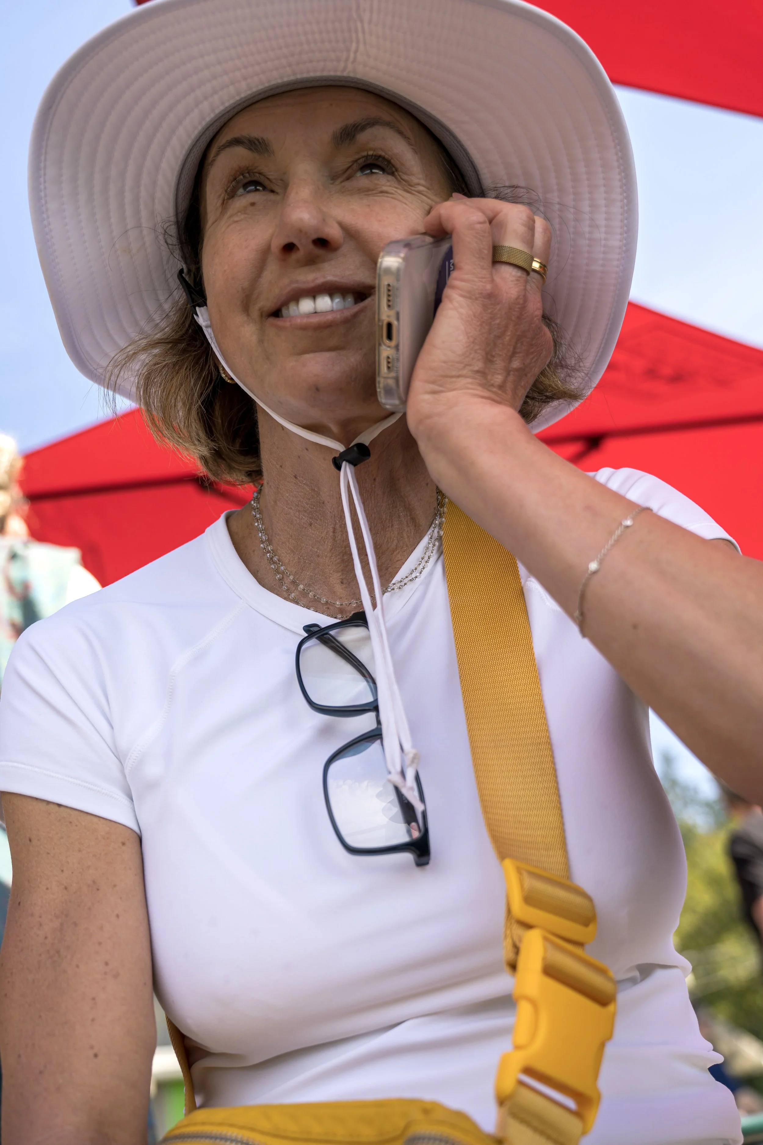 Alicia on phone under hat.jpg