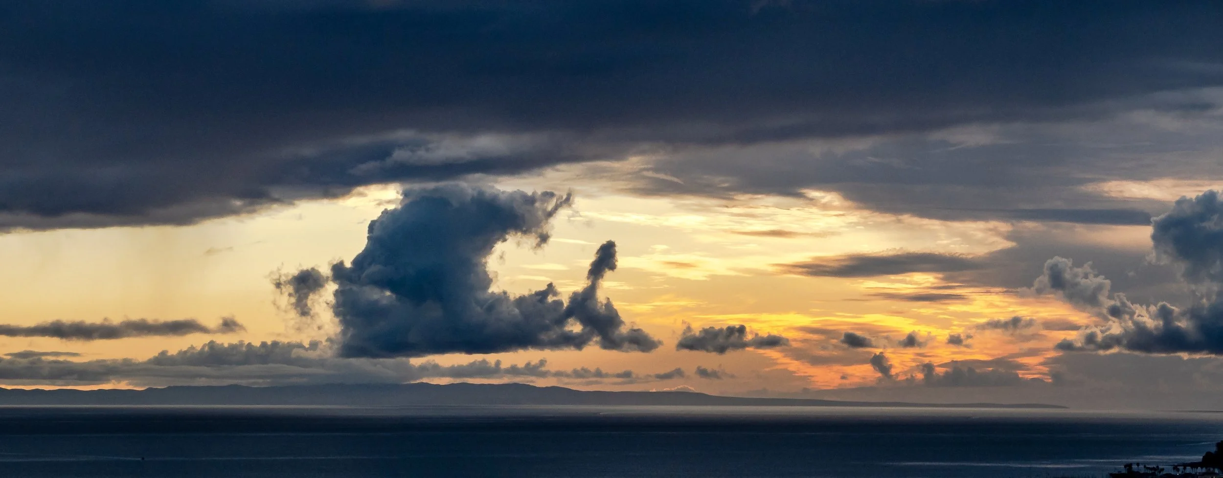 Sunset tall cloud and orange sky wide color.jpg