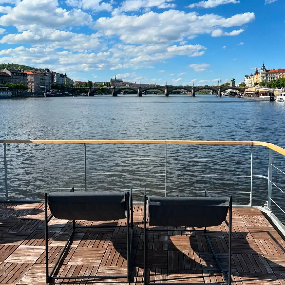 Private party boat in Prague with a view of Charles Bridge on the Vltava River