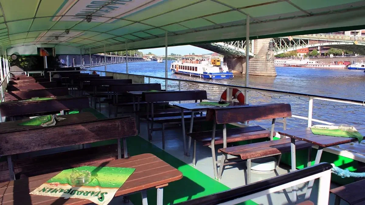 Empty outdoor deck ready for catering on the Vltava River