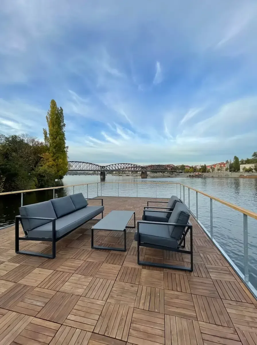 Sun deck on a private party boat in Prague with views of the city