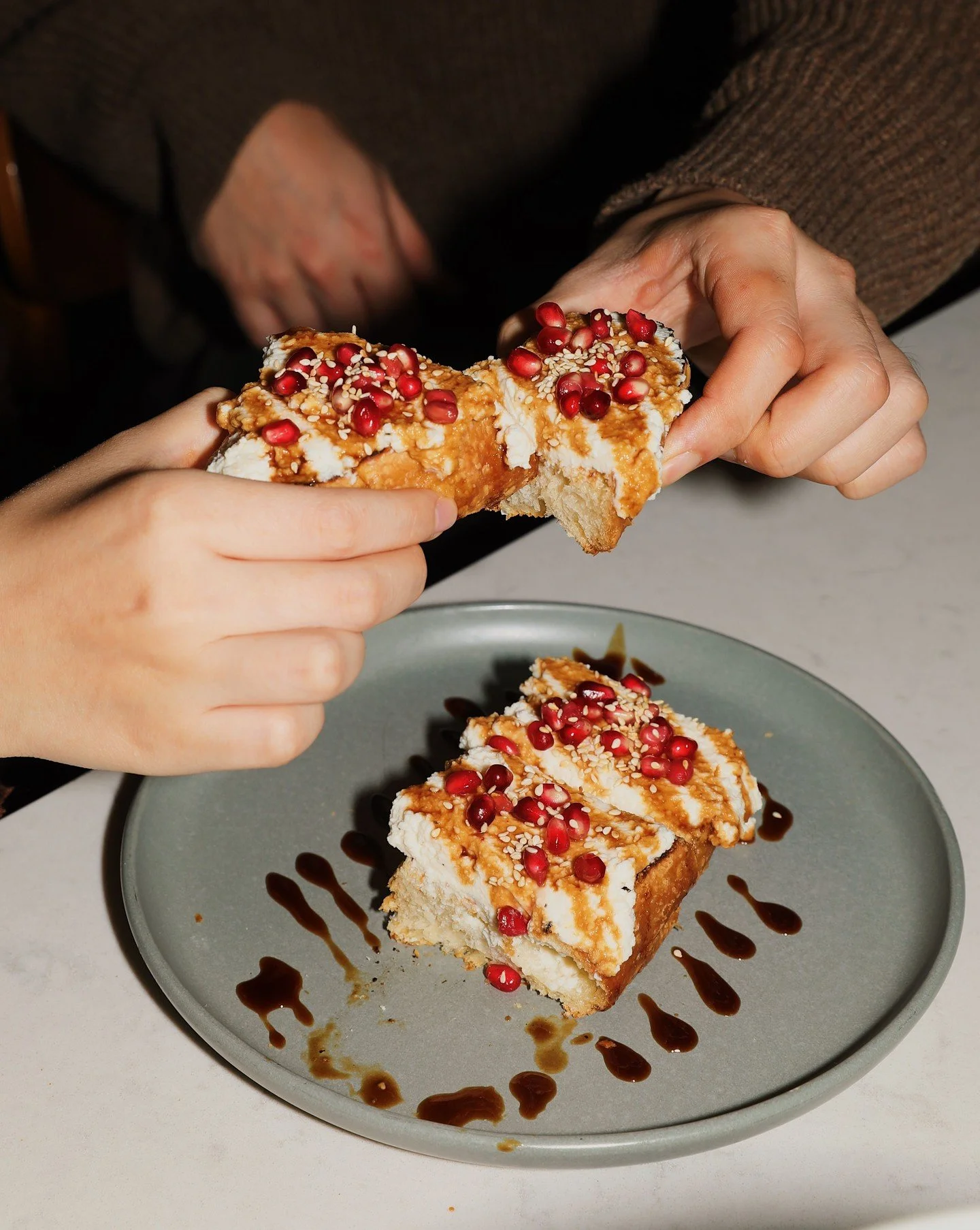 Start the night off right. Ricotta toast is now on the menu&mdash;thick-cut sourdough layered with whipped ricotta, finished with pomegranate seeds, sesame, and a drizzle of balsamic.