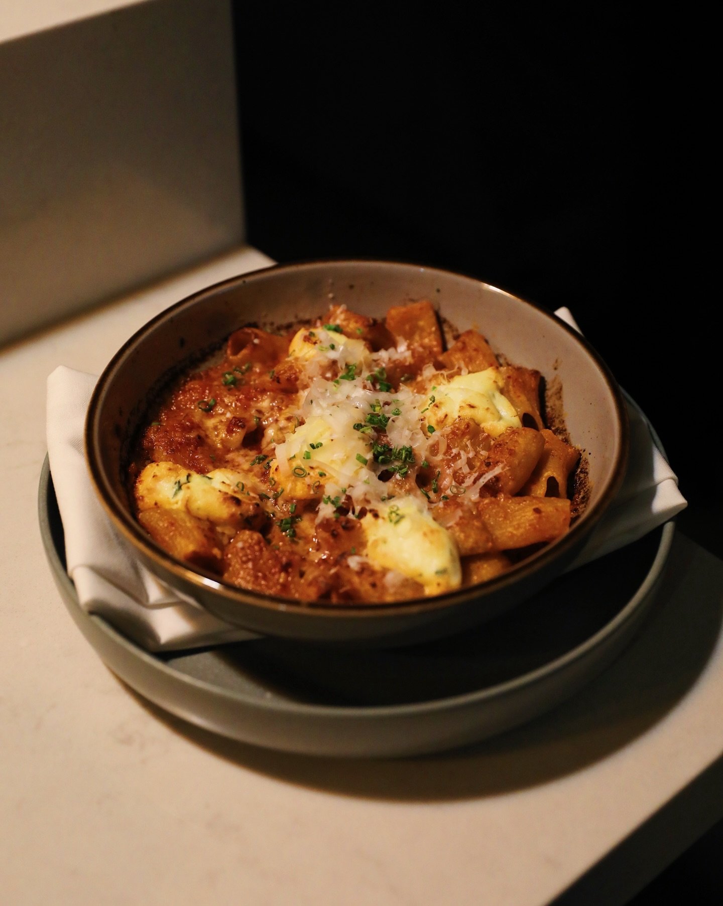 Our favorite pasta as of late has been the Rigatoni.

Fresh sheets rolled and cut, built to hold a slow-simmered tomato enriched with nduja, a delicious Calabrian pork salumi that melts into the sauce, lending warmth, depth, and a quiet heat that lin