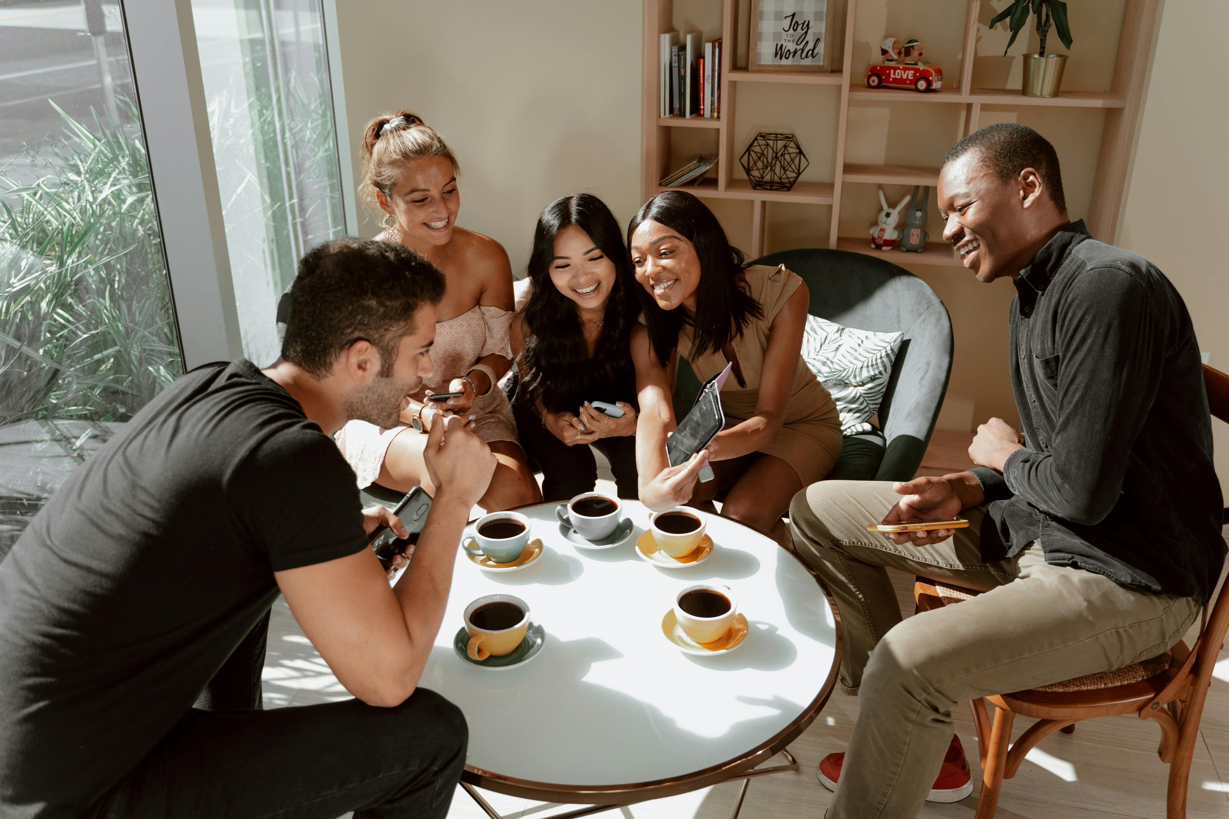 Group of Friends bonding Together in a Cafe