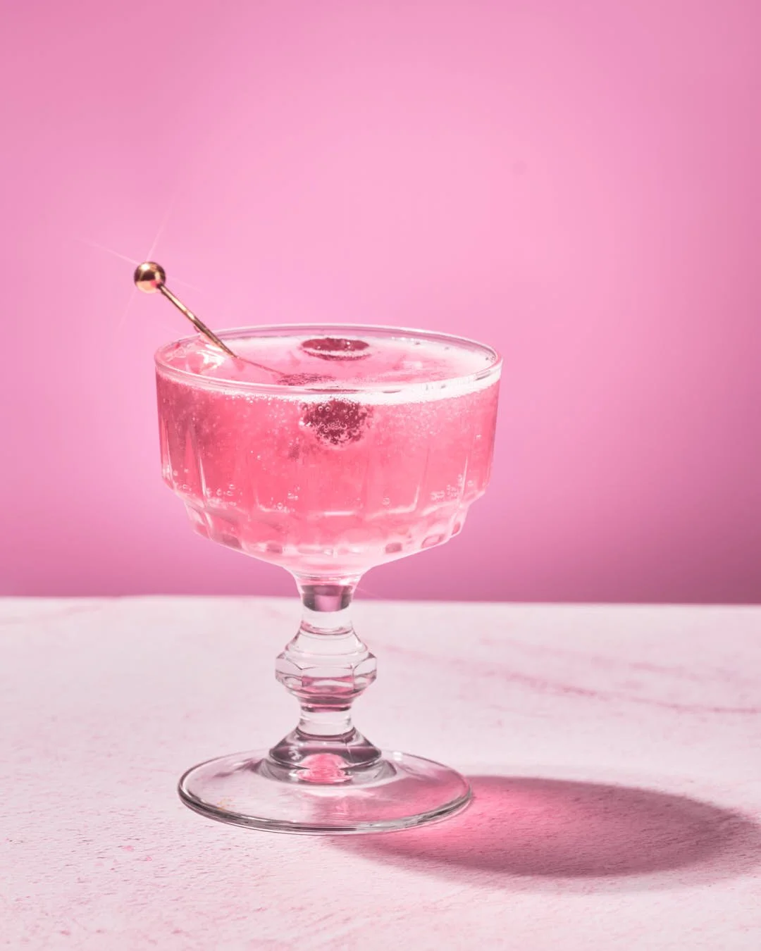 Raspberry pink drink on pink background captured by Jan - The Resilient Creative - Food Photographer in Far North Queensland Australia