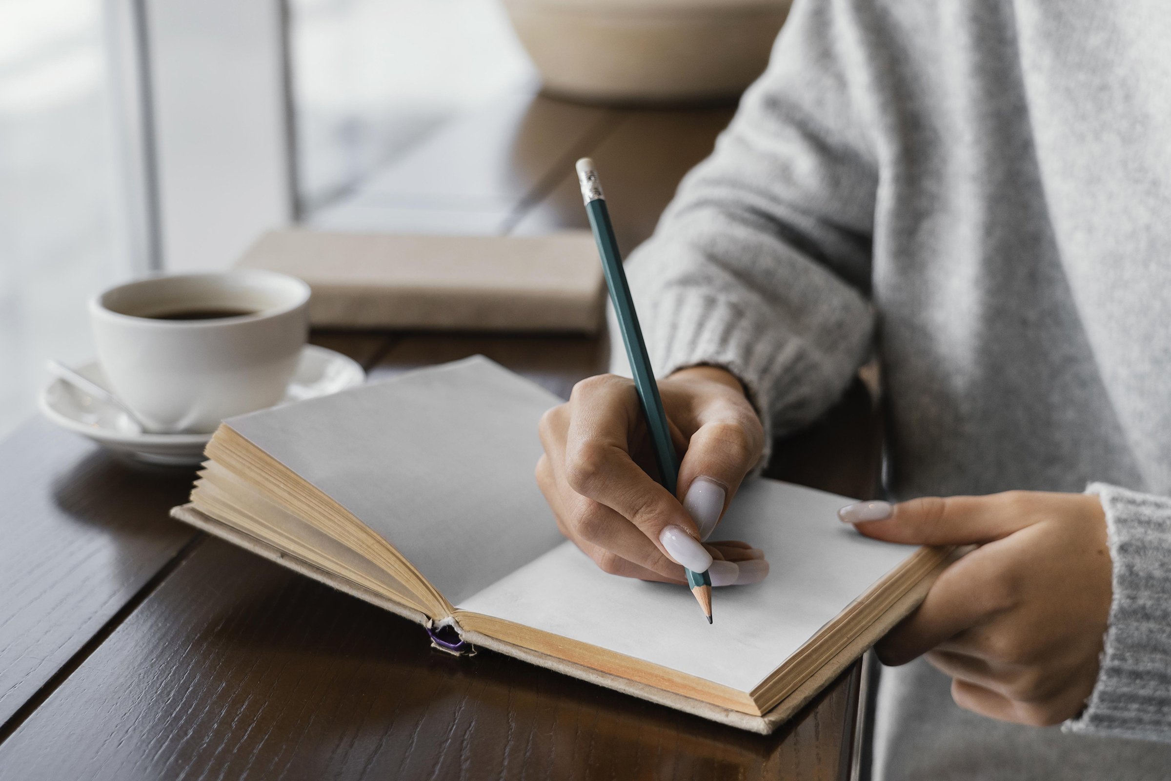 close-up-hand-writing-notebook.jpg