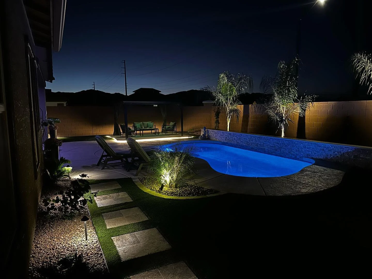 Outdoor Lighting installed by Garcia's Dreamscape to compliment the tree features, walkways and more near Phoenix, Arizona