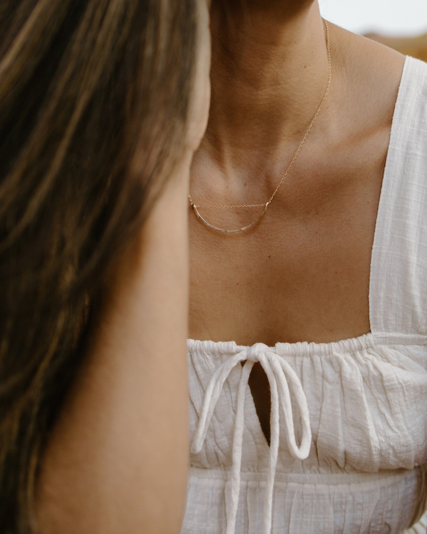 The half moon necklace has been one of our top sellers for years now! Hammered (by hand) 14k gold fill wire. Now available in three sizes! 🌙⁠
⁠
#mirakauai #minimalistjewelry #handmadejewelry #goldjewelry #14kgoldjewelry #goldnecklace #hammeredgoldne