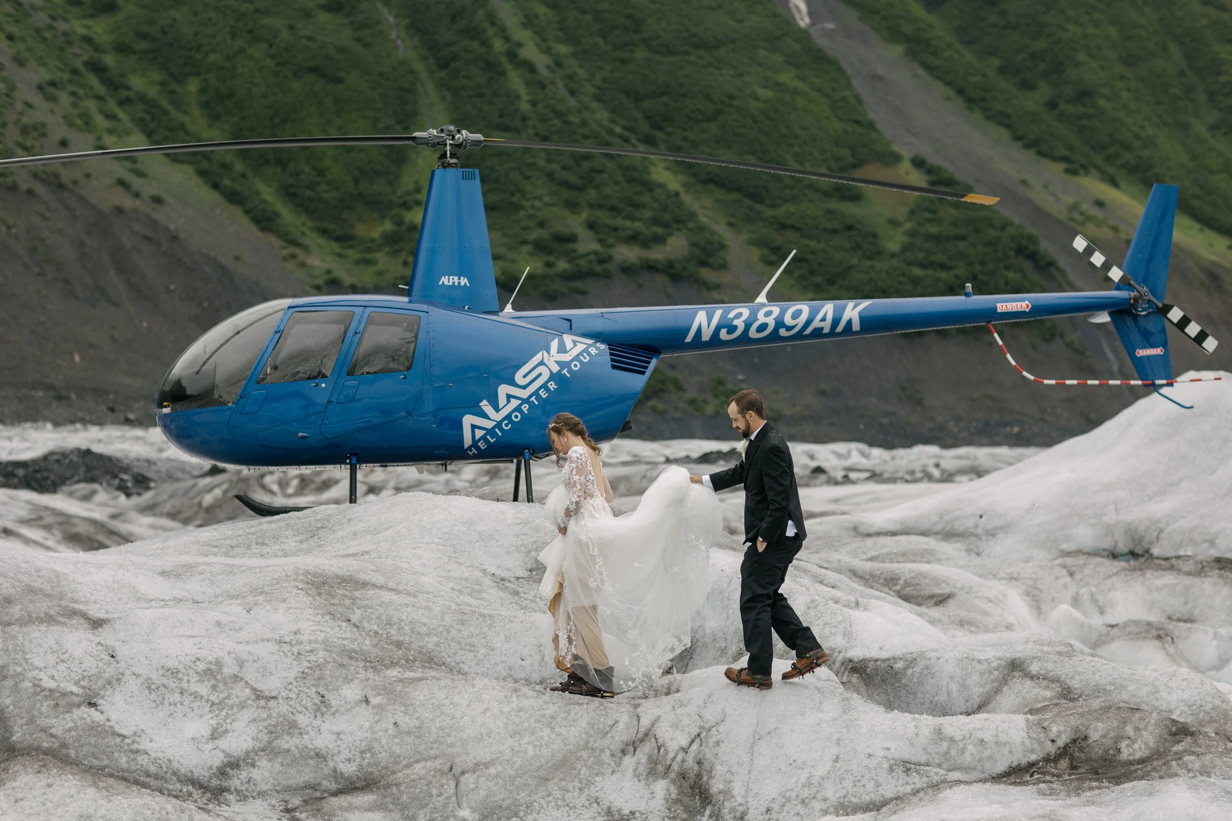 Helicopter landing on a remote glacier for an Alaska elopement