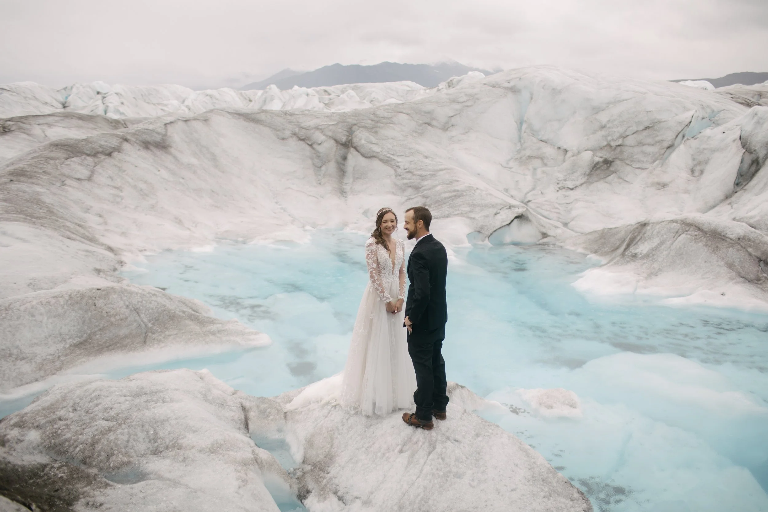 couple saying vows during adventure elopement