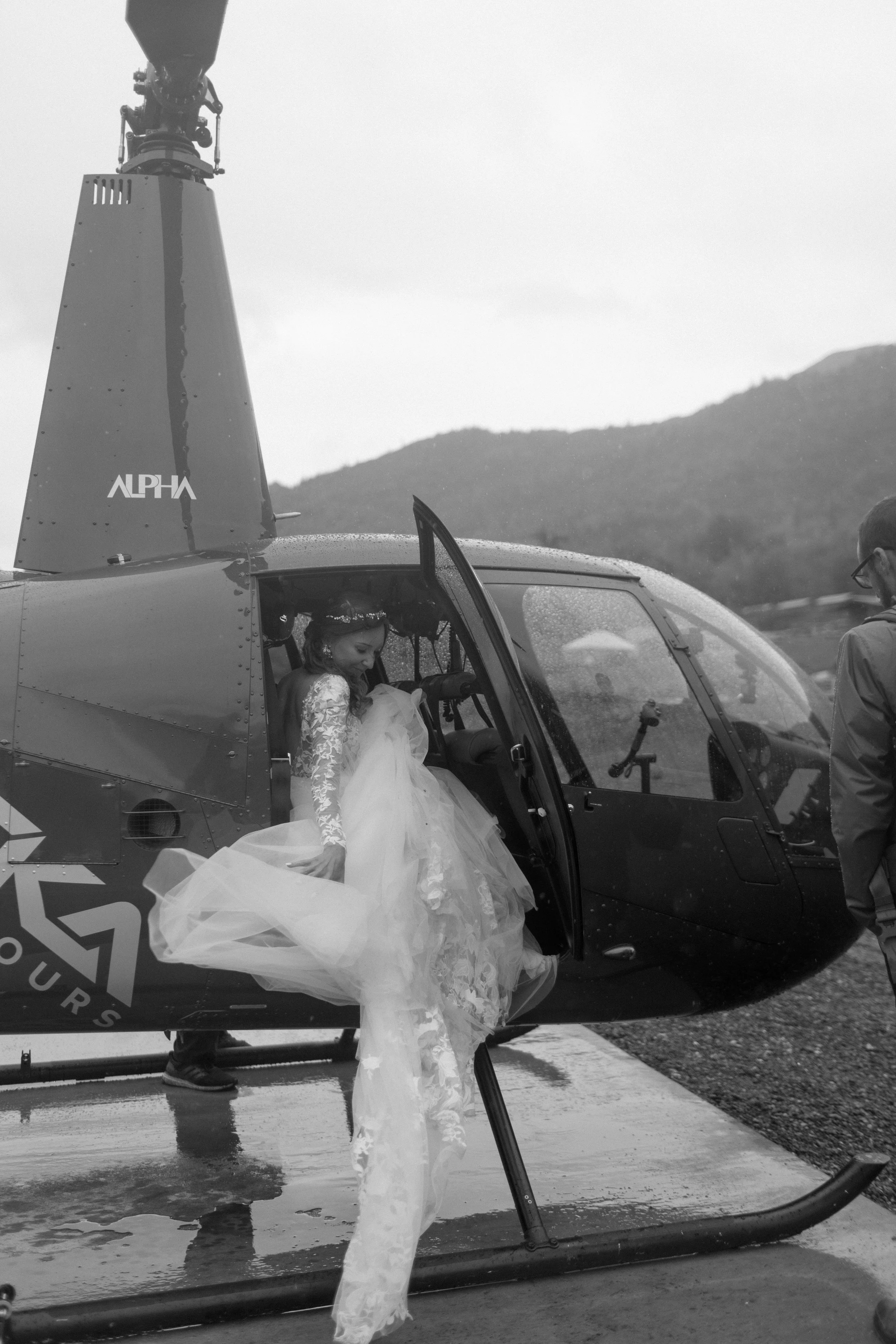 bride getting in helicopter before elopement