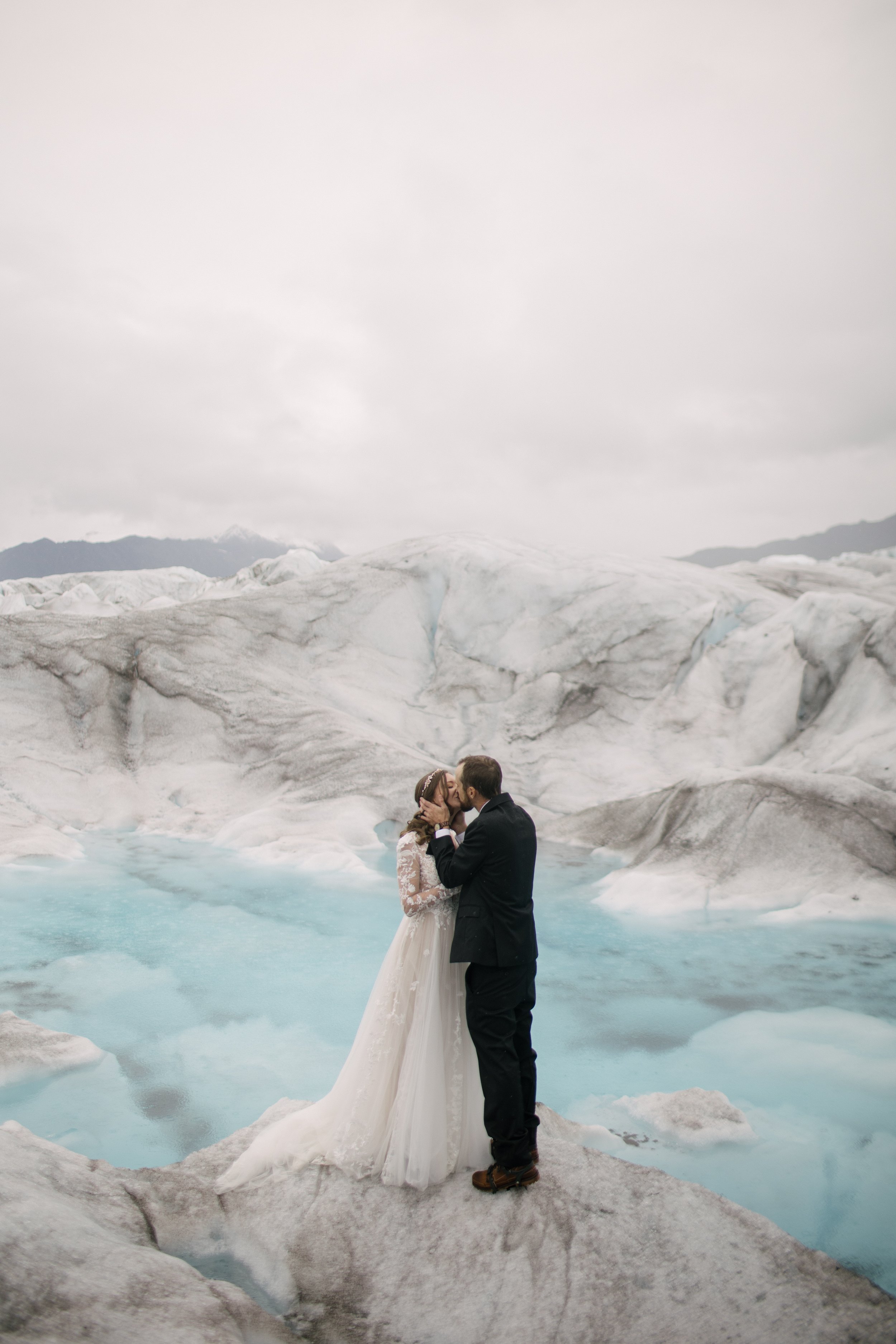 couple kissing during alaska elopement