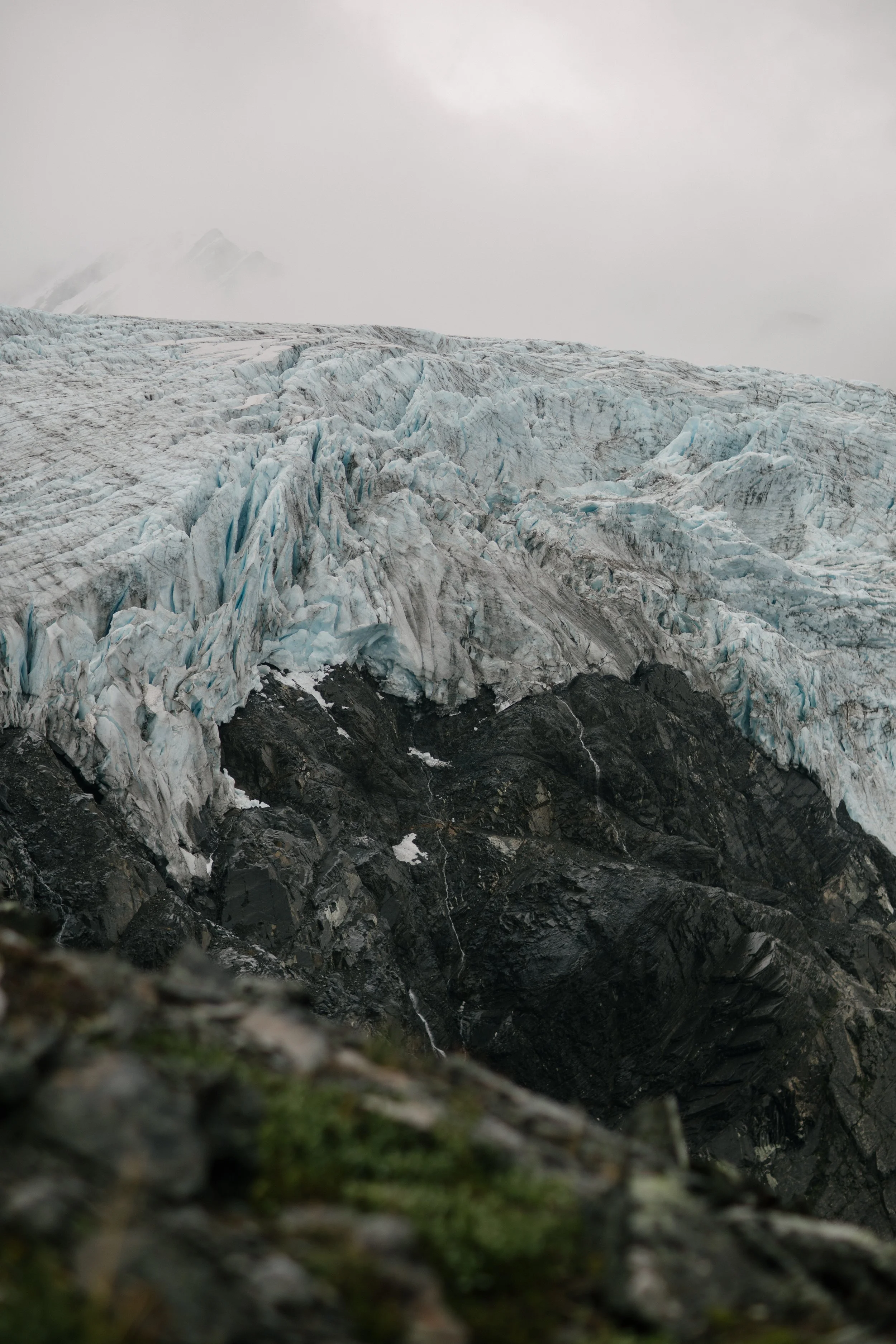 Tall glacier seen from helicopter in alaska