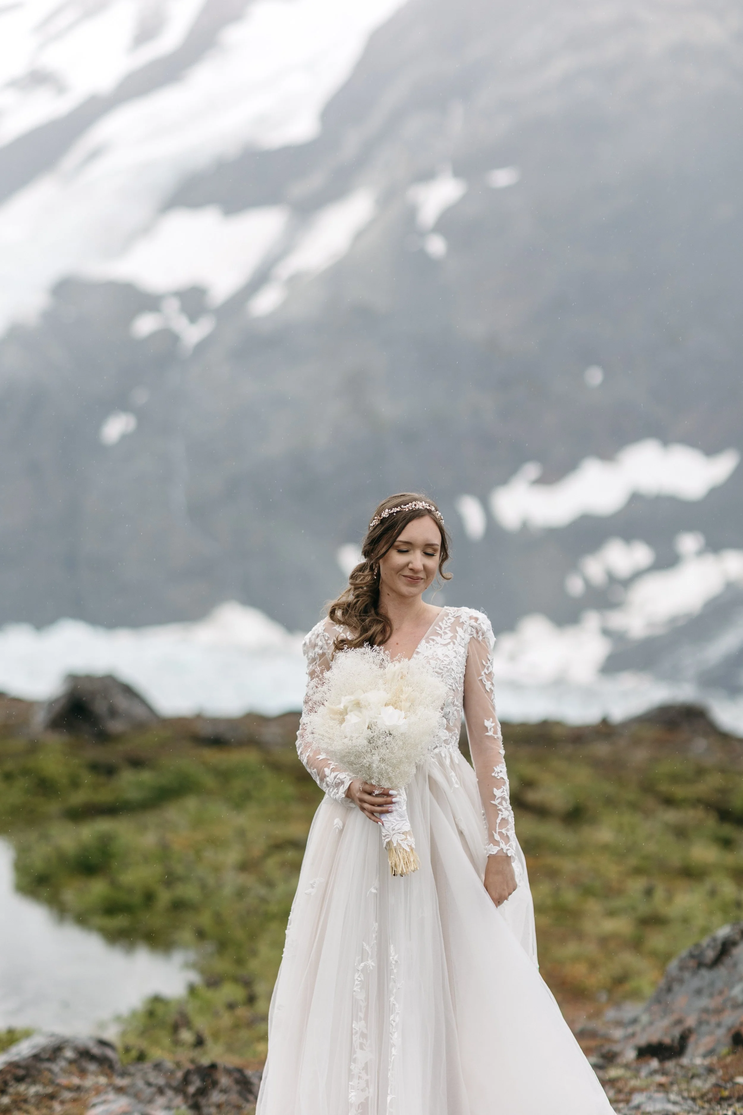 bride takes in alaska landscape