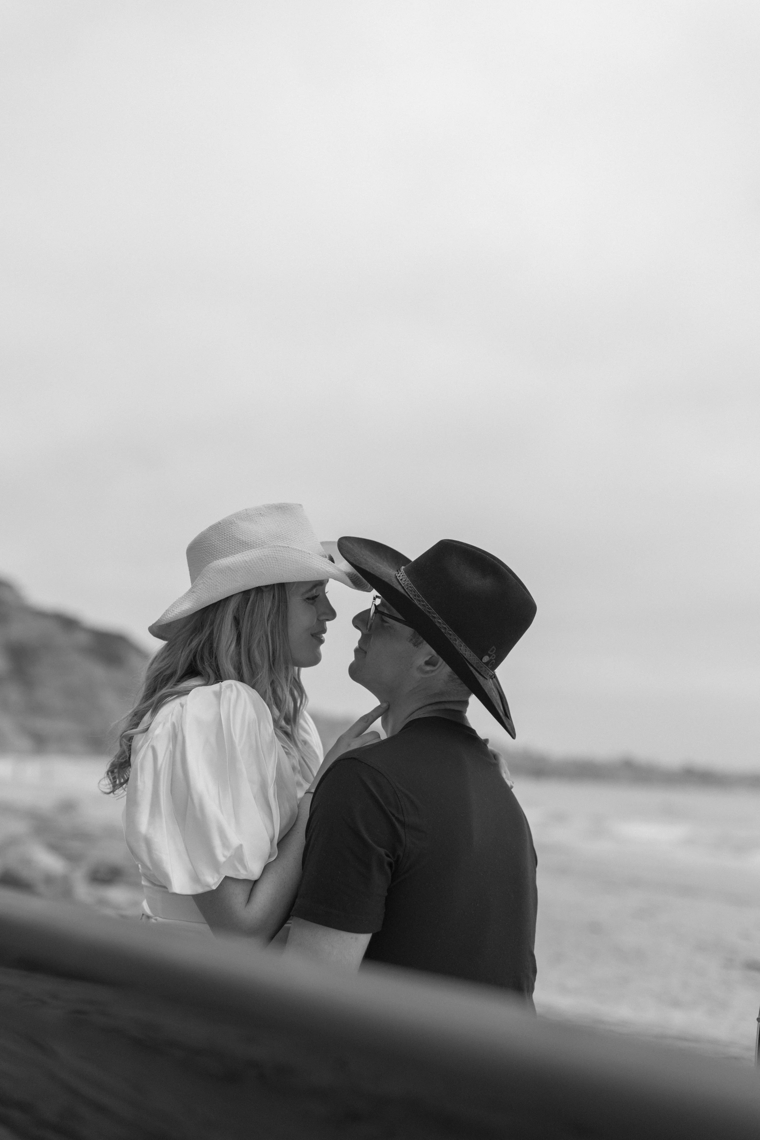 couple almost kissing during engagement shoot at torrey pines