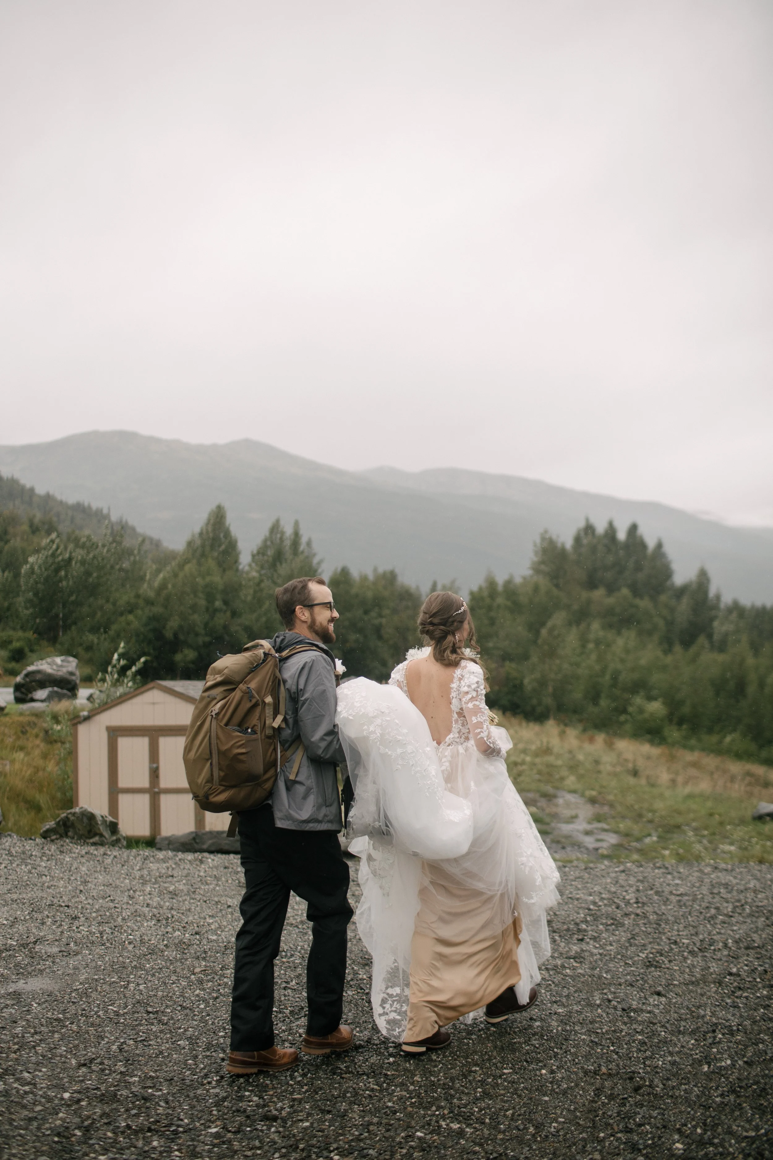 Bride and groom walking to helicopter for intimate elopepent