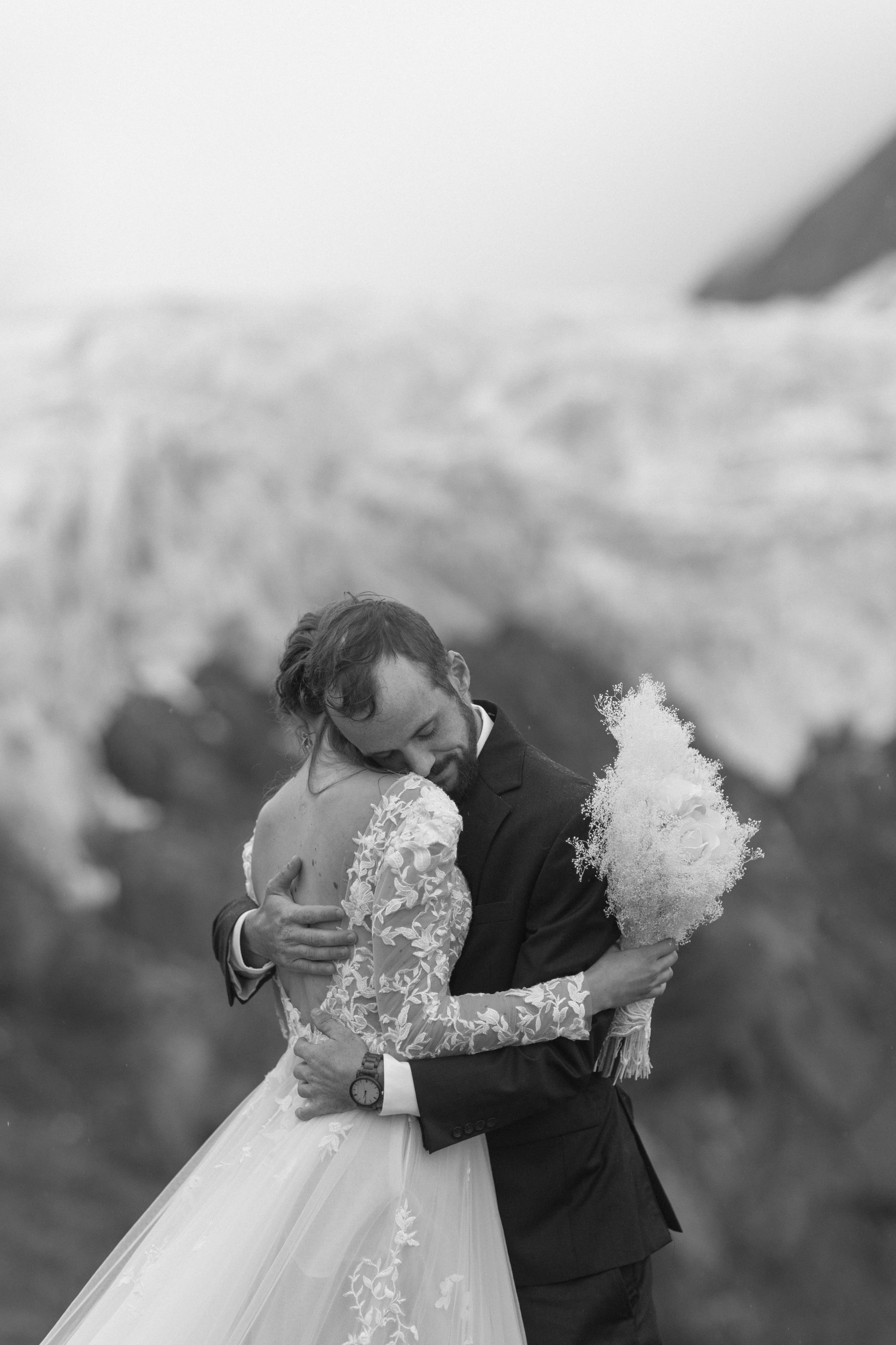 couple hugging during alaska elopement