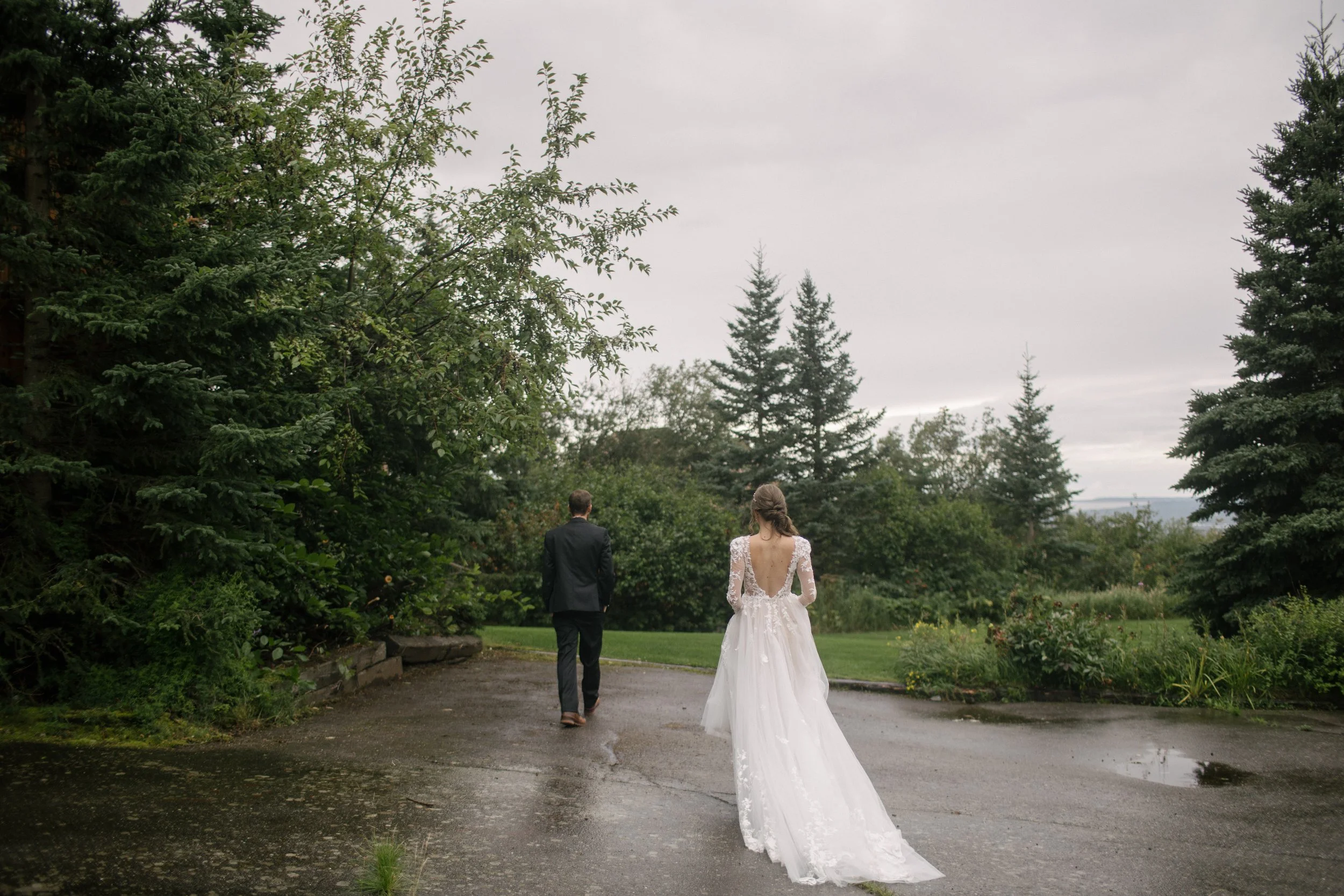 Bride and groom walking before intimate elopement ceremony