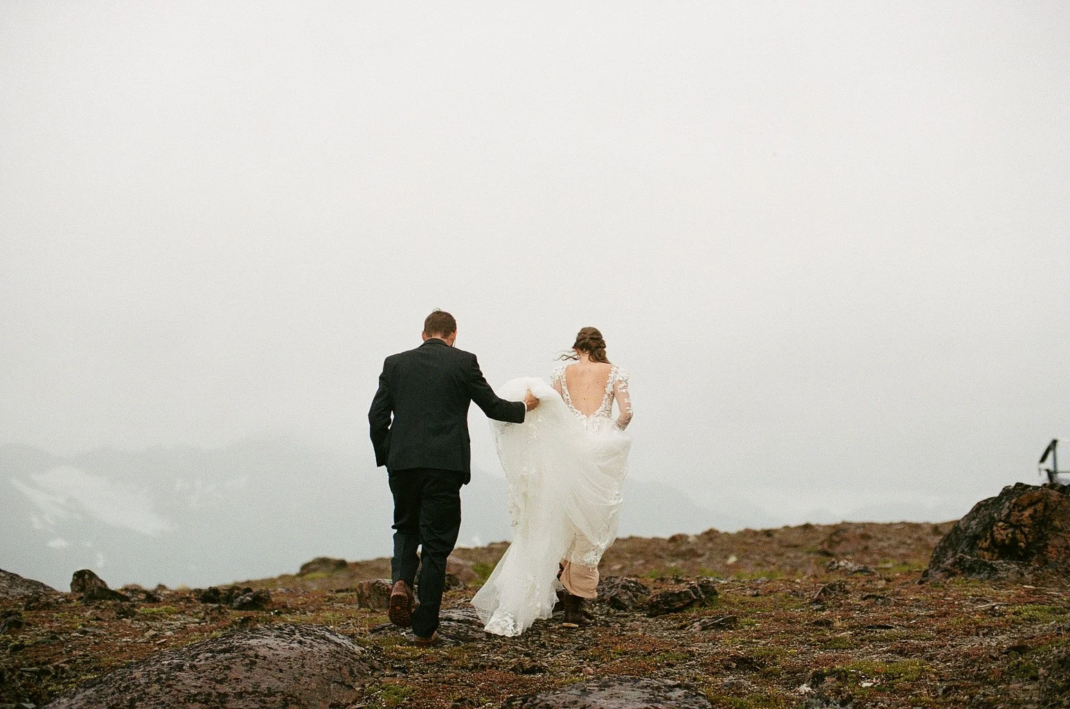 Couple hiking together during adventure elopement