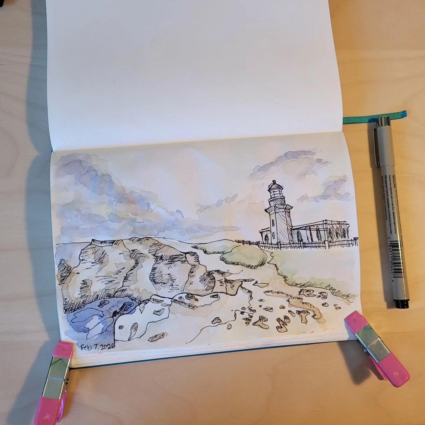 Sketch of the day created with a black pen and then watercolor was. It's a lighthouse overlooking a cliff I visited with my friends in Puerto Rico