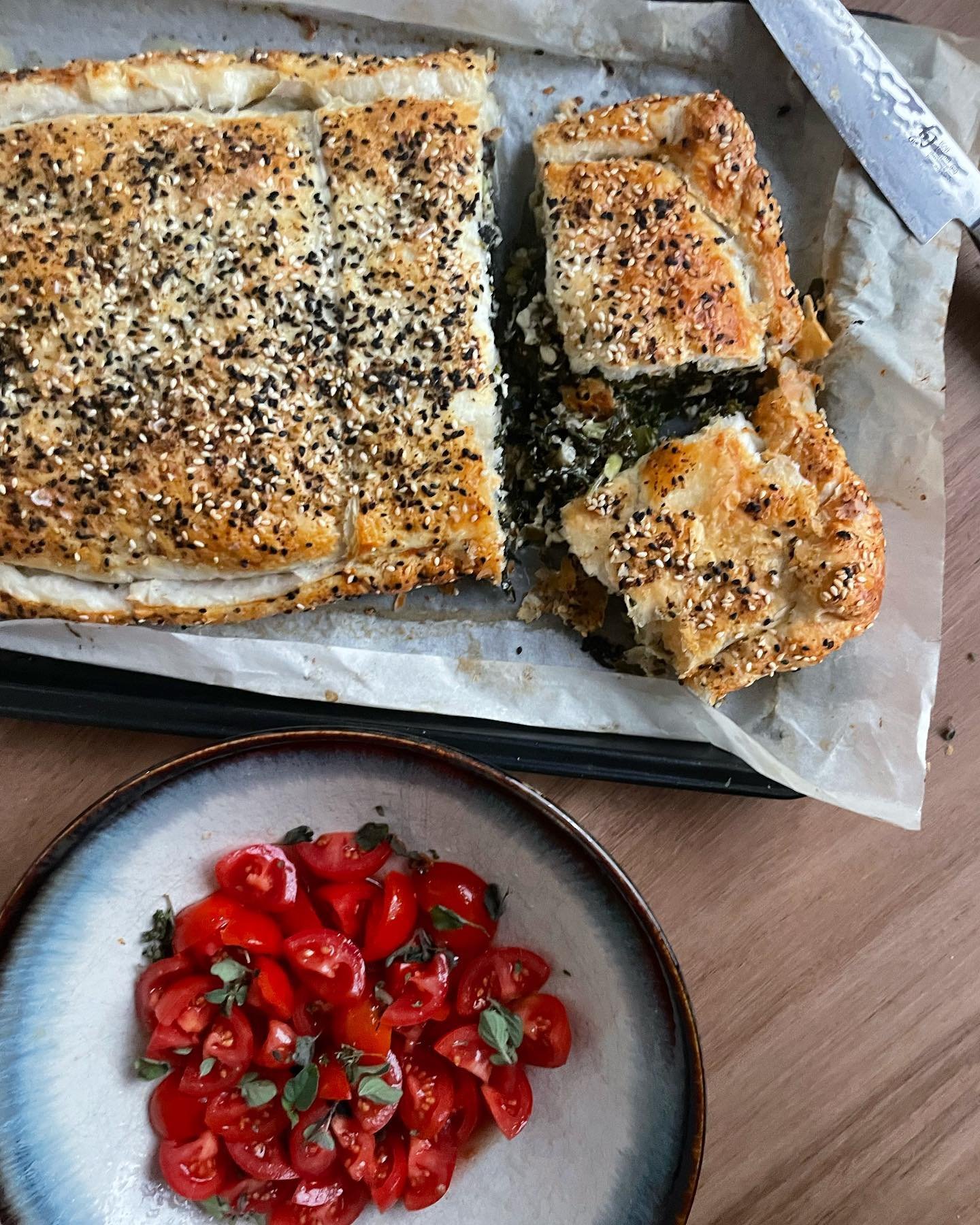 A very rustic slab pie, an easy way to finish off any veggies lying around at the end of the week. 

This one had all the greens, herbs, caramelised onion and ricotta. 

I always have some random puff pastry lying around in the freezer. Sandwich your