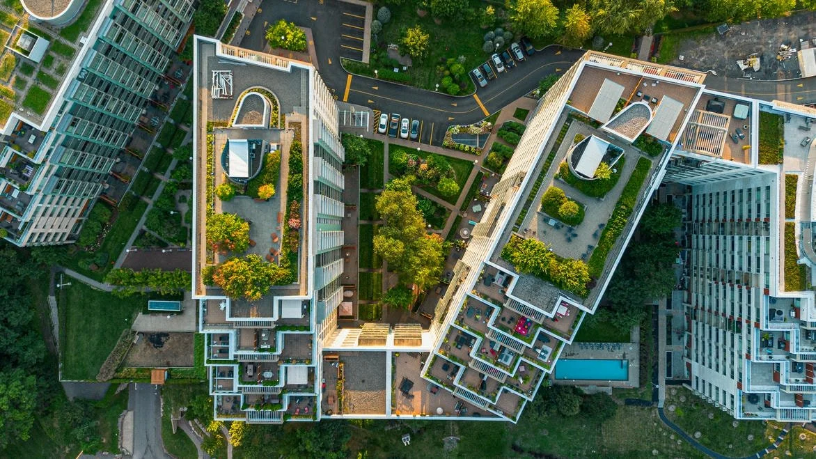 Aerial shot looking down massive appartment building complex rooftop
