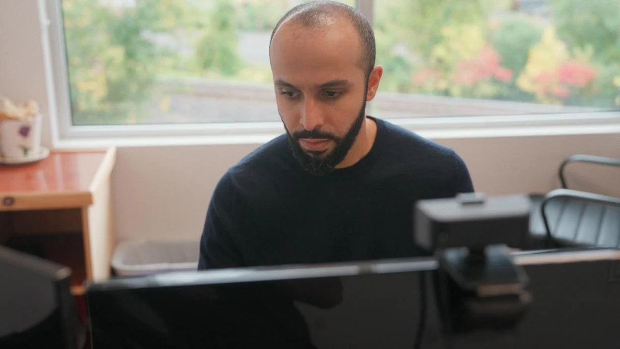 man working at his computer