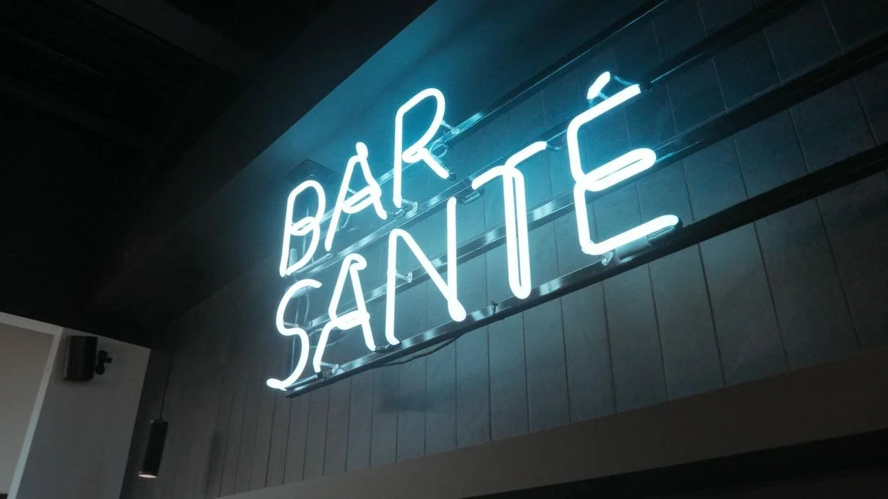 neon sign in dark moody kitchen