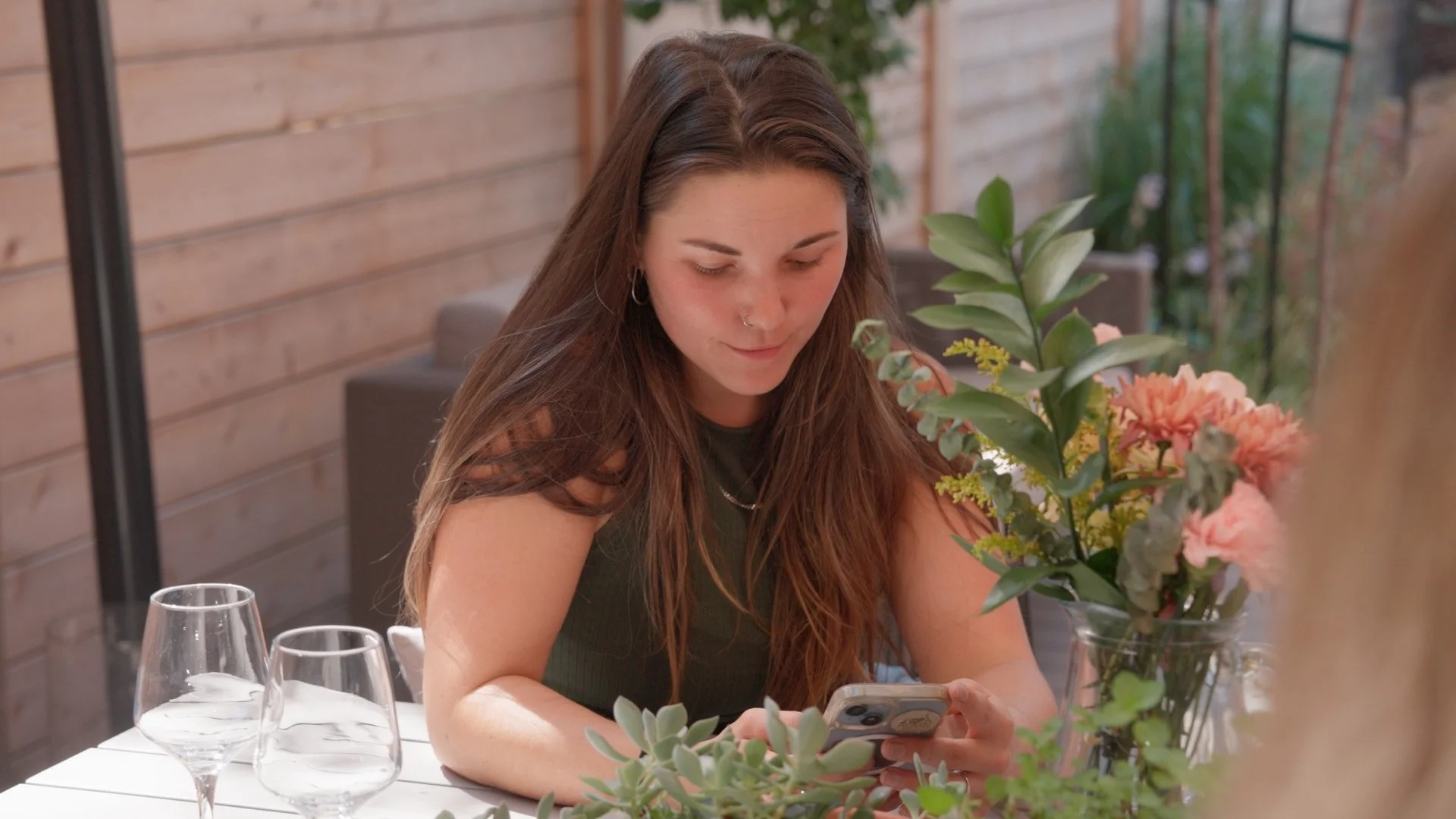 Girl playing on her phone outside summer_1.62.1.jpg