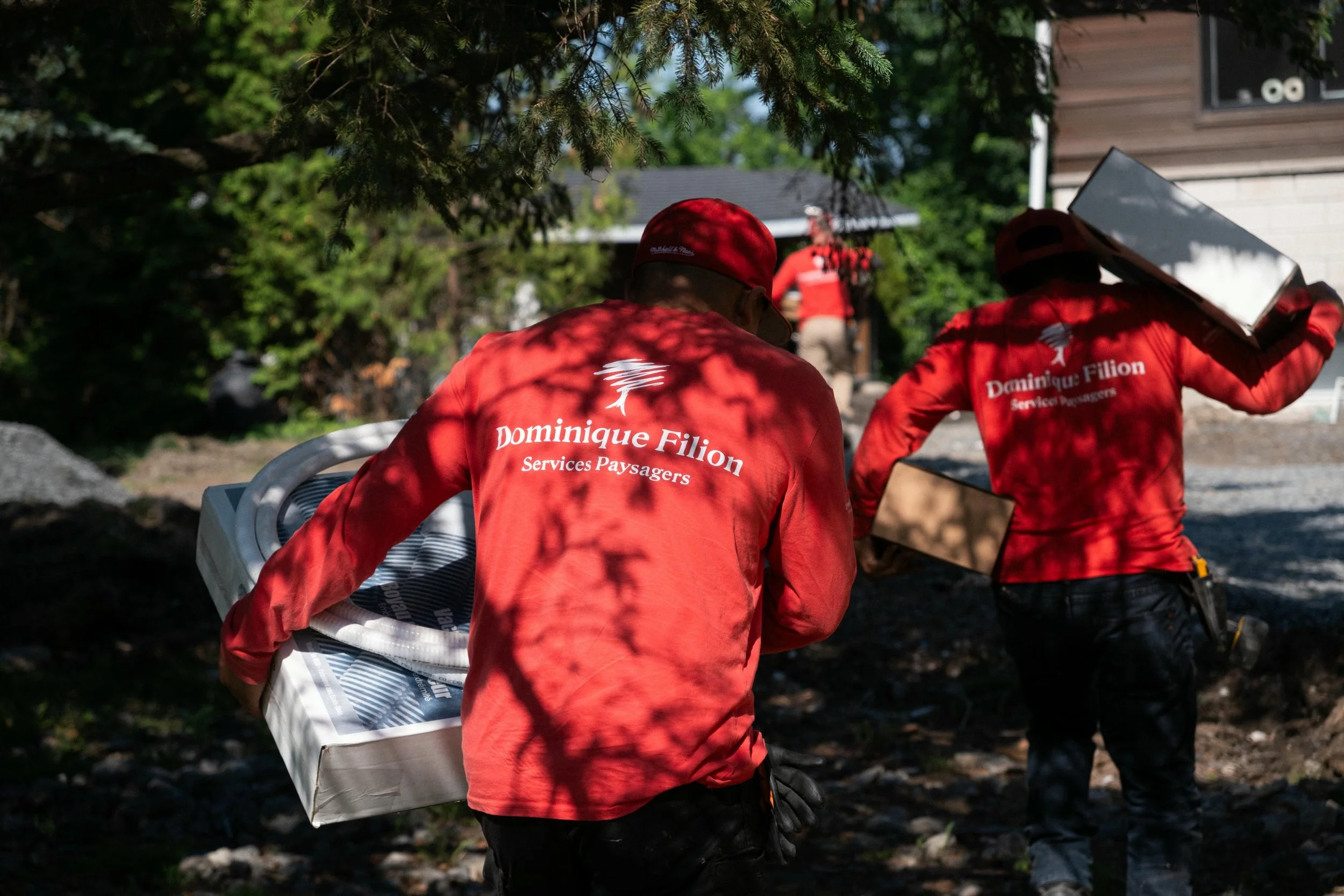 Landscape workers wearing company t-shirts