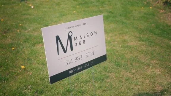 Sign on lawn in front of house