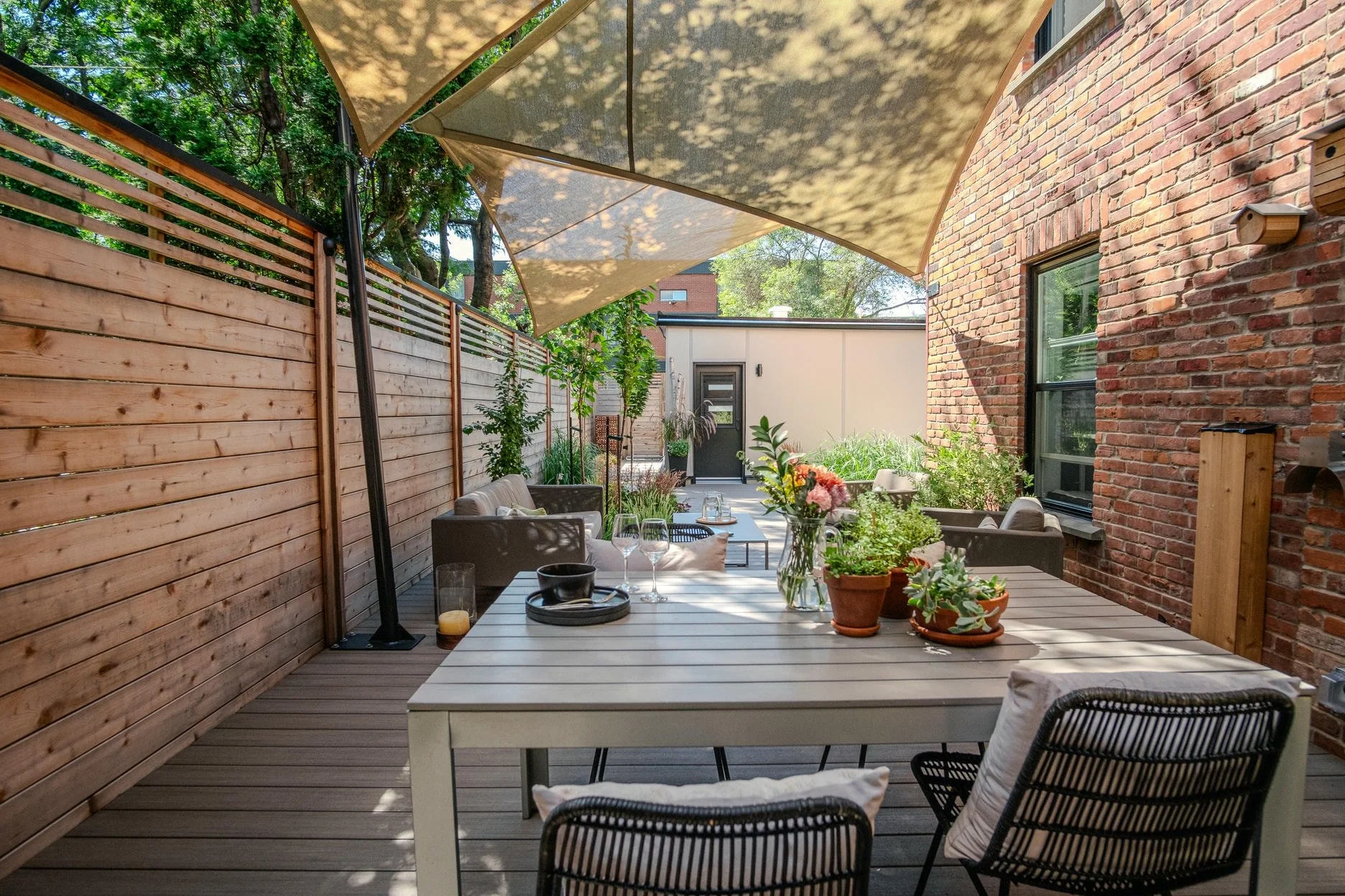 backyard installation with dining table summer weather