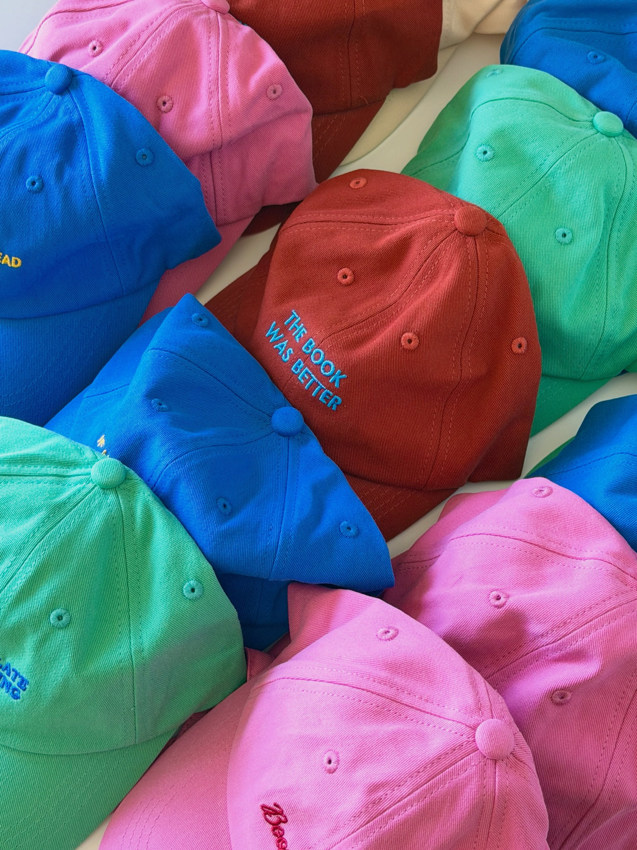 The kind of colors you build an entire personality around for 3 months 🍊🌸🫐🌊

Summer hats drop next week.

#bookishmerch
