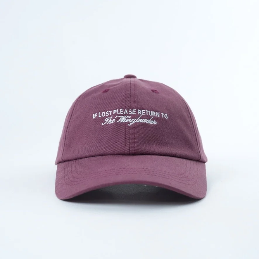 Purple baseball hat that reads If lost please return to the wingleader