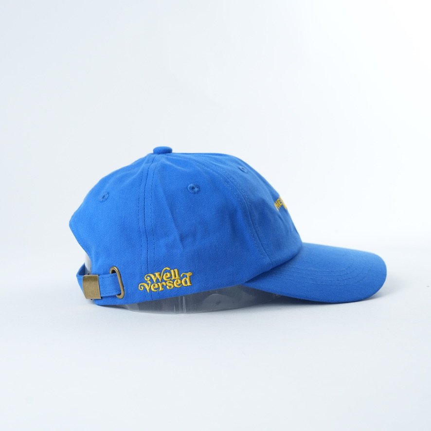 Bright blue cotton dad hat featuring yellow embroidered text that reads “IF HE DOESN'T READ DUMP HIM.”