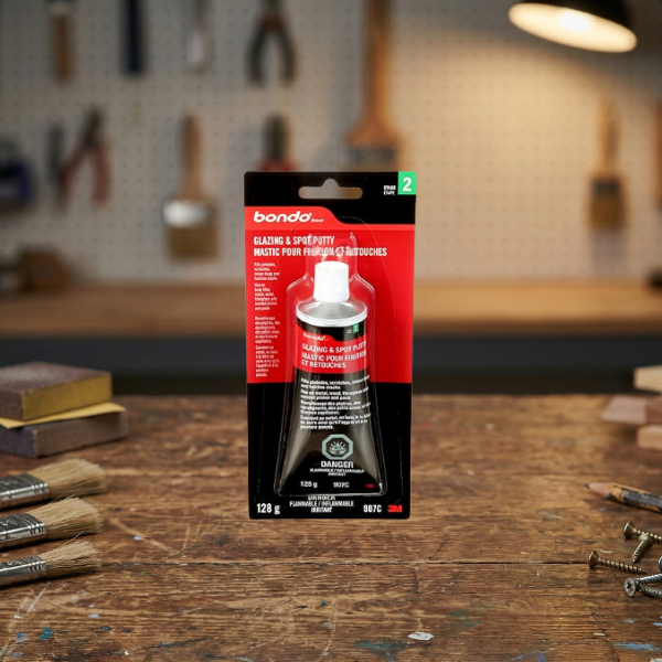 Bondo glazing and spot putty is used to fill wood grain and very small, minor damage