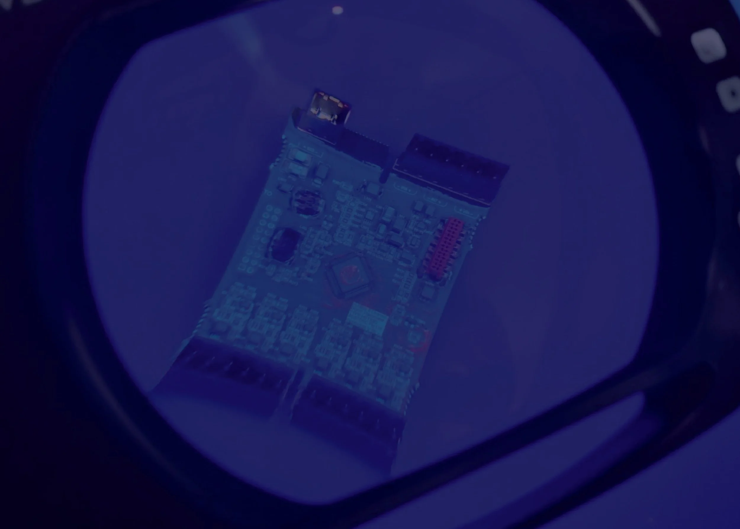 Printed circuit board (PCB) under inspection during electronic manufacturing quality assurance process, showcasing precision assembly, component placement, and advanced PCB testing for reliable electronics production.
