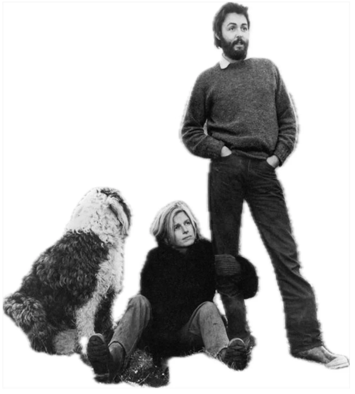 Paul McCartney and Linda McCartney in Scotland looking into the distance with a dog,