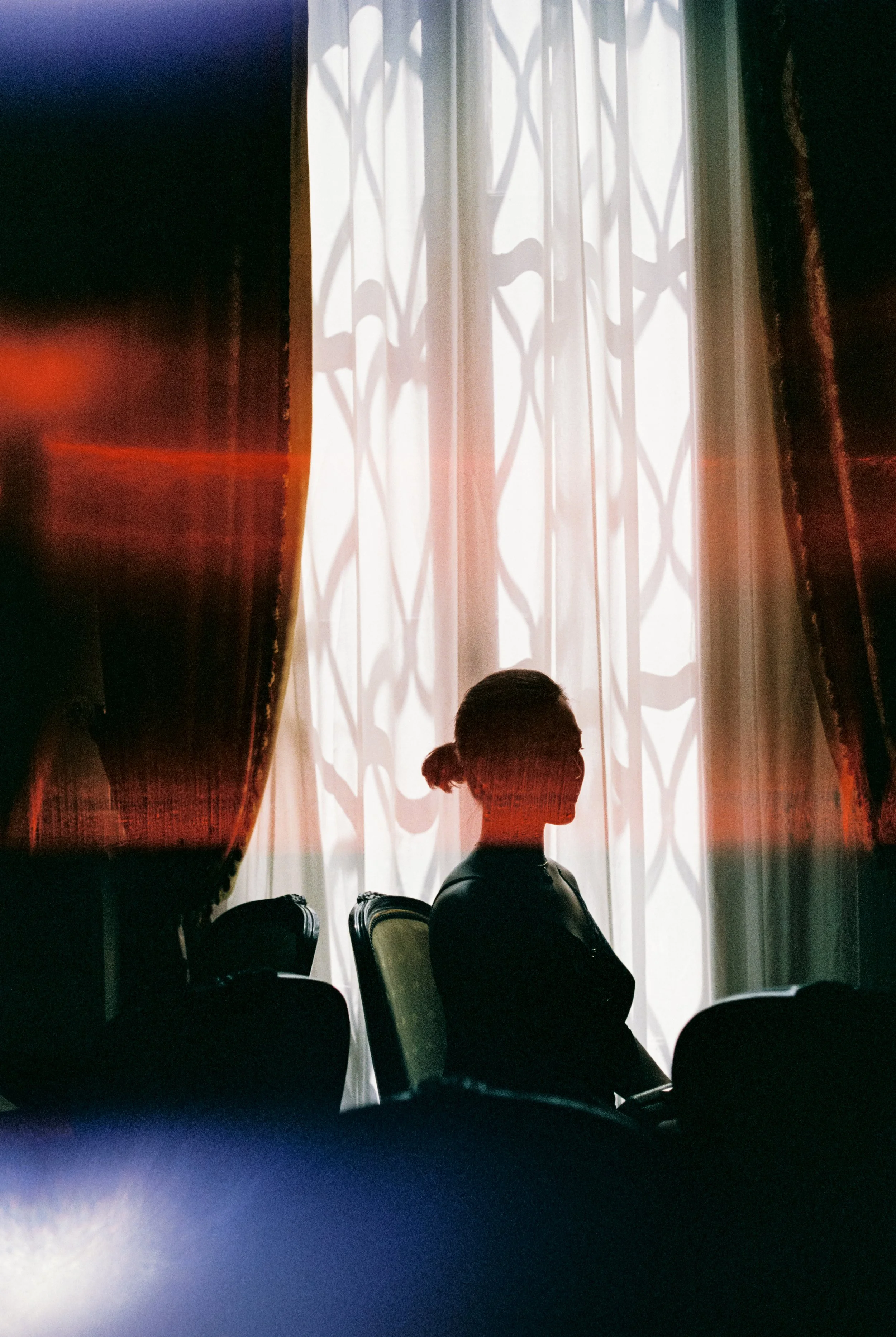 Cinematic silhouette of a person indoors, representing original music for film and visual media