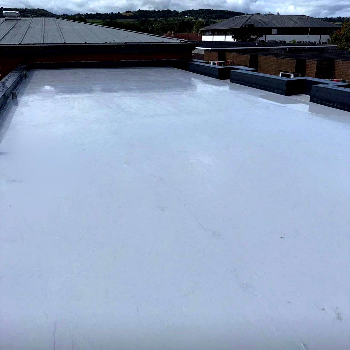 Commercial unit roof insulation, overboard membrane and Lava 20 waterproofing project in North Wales